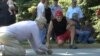 Men play a game of marbles in Etoile, Kentucky. (VOA) 