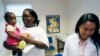 FILE - Jaliyah Smith, 13-month-old niece of Felicia Sykes of Starkville, Miss., gets a checkup by Dr. Minerva Rasalan, April 25, 2007, in West Point, Miss. For many foreign trained doctors, practice in the U.S. provides better pay and working conditions.