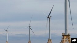 FILE - Turbines operate at the Block Island Wind Farm, December 7, 2023, off the coast of Block Island, Rhode Island. Nations have signed on to triple renewable energy by 2030.