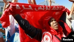 An anti-government protester rallies for the dissolution of the Islamist-led government in Sfax, 170 miles (270 km) southeast of Tunis, Tunisia, Sept. 26, 2013. 