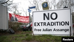 A sign is seen outside Woolwich Crown Court, ahead of a hearing to decide whether Julian Assange should be extradited to the United States, in London, Britain February 24, 2020.