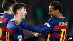 File photo: FC Barcelona's Lionel Messi, left, is congratulated by his teammate Neymar, after scored during a Spanish La Liga soccer match against Real Sociedad at the Camp Nou stadium in Barcelona, Spain, Nov. 28, 2015. (AP Photo/Manu Fernandez)