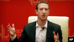 FILE - Facebook CEO Mark Zuckerberg speaks during a panel discussion in Beijing, March 19, 2016. The world’s biggest social network is starting to face the consequences of not preventing the often unforeseen problems that keep cropping up on its platform, from false news to real ads from agents of the Russian government looking to influence the U.S. election.