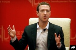 FILE - Facebook CEO Mark Zuckerberg speaks during a panel discussion in Beijing, March 19, 2016.