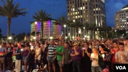 FILE - People gather outside the Dr Phillips Center for Performing Art in Orlando for a vigil for the victims and the injured of Orlando nightclub shooting. (S. Dizayee/VOA)
