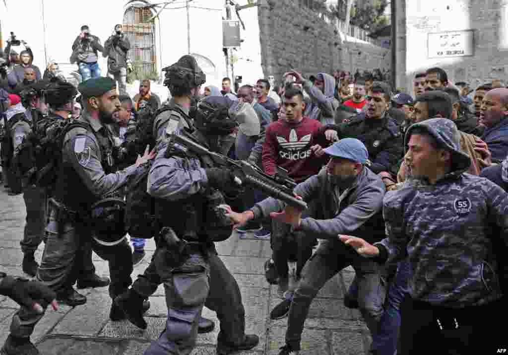 Israeli security forces and Palestinian protesters confront each other in Jerusalem's Old City.