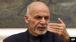 FILE - Afghan President Ashraf Ghani speaks during a press conference at the presidential palace in Kabul, Dec. 31, 2015. Ghani said on March 6, 2016, his security forces have uprooted loyalists of Islamic State in the country.