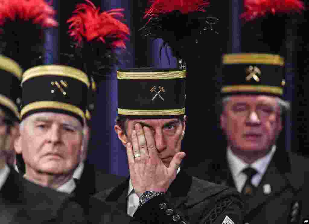 A coal miner in a traditional dress hides tears during a closing ceremony of the last German coal mine Prosper-Haniel in Bottrop, Germany.