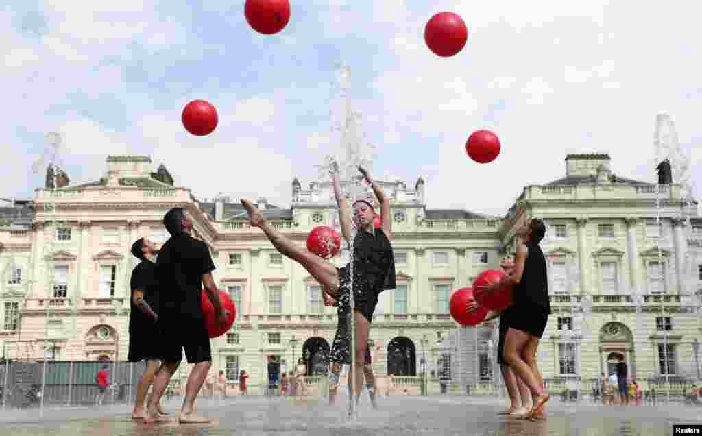 Performers from Gandini Juggling rehearse their act "Cascade" ahead of a festival of contemporary circus at Somerset House in London, Britain.