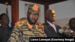 South Sudan President Salva Kiir tells reporters at a news conference in Juba that the government has "full control" of the situation in the capital after what he says was an overnight coup attempt, Dec. 16, 2013.