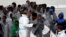 FILE - Migrants disembark from Italian Coast Guard patrol vessel Diciotti in the Sicilian harbor of Catania, Italy, Nov. 16, 2016. Nearly 11,000 asylum-seekers and economic migrants, mainly from African nations, arrived on Italian shores in a four-day period, June 24-27.