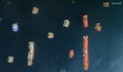 FILE - This handout satellite imagery taken on March 23, 2021 and received on March 25 from Maxar Technologies shows Chinese vessels anchored at the Whitsun Reef, around 320 kilometres (175 nautical miles) west of Bataraza in Palawan in the South China Sea. (AFP)
