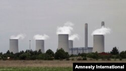 FILE - The cooling towers at Eskom's coal-powered Lethabo power station are seen near Sasolburg, South Africa. 