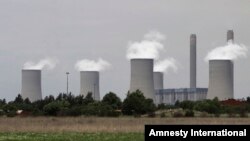 In this 2011 file photo, Eskom coal power stations generate power for South Africa's electrical grid. (AP Photo/Denis Farrell) 