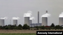 FILE - The cooling towers at Eskom's coal-powered Lethabo power station are seen near Sasolburg, South Africa. 
