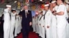 FILE - In this Oct. 6, 1994 file photo, President Bill Clinton salutes sailors aboard the USS Eisenhower in Norfolk, Va. Clinton's "don't ask, don't tell" policy prohibited gay men and women from serving openly in the armed forces. Congress eventually repealed the policy.