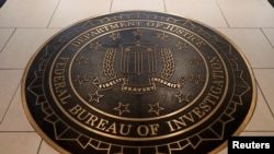 FILE - The Federal Bureau of Investigation seal is seen at FBI headquarters in Washington