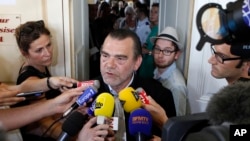 FILE - French lawyer, Franck Berton, answering questions to the media at the Douai courthouse, northern France. Berton was going to court on Wednesday to try to halt the 24-hour video surveillance of his client.