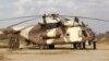 Kenya Defense Forces soldiers service helicopter near Kenya-Somalia border, Feb. 20, 2012 (file photo).
