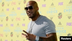 FILE - Rapper Flo Rida arrives at the 2015 Teen Choice Awards in Los Angeles, California, Aug. 16, 2015. 