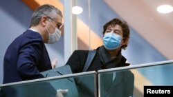Lothar Wieler, the head of Germany's Robert Koch Institute (RKI) for disease control, and Director of the Institute for Virology at the Charite Christian Drosten leave after a news conference, amid the spread of COVID-19, in Berlin, Jan. 22, 2021.