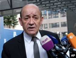 French Foreign Minister Jean-Yves Le Drian speaks with the press before meeting with German Foreign Minister Heiko Maas, British Foreign Secretary Boris Johnson, European Union foreign policy chief Federica Mogherini and Iranian Foreign Minister Javad Zarif earlier in May..