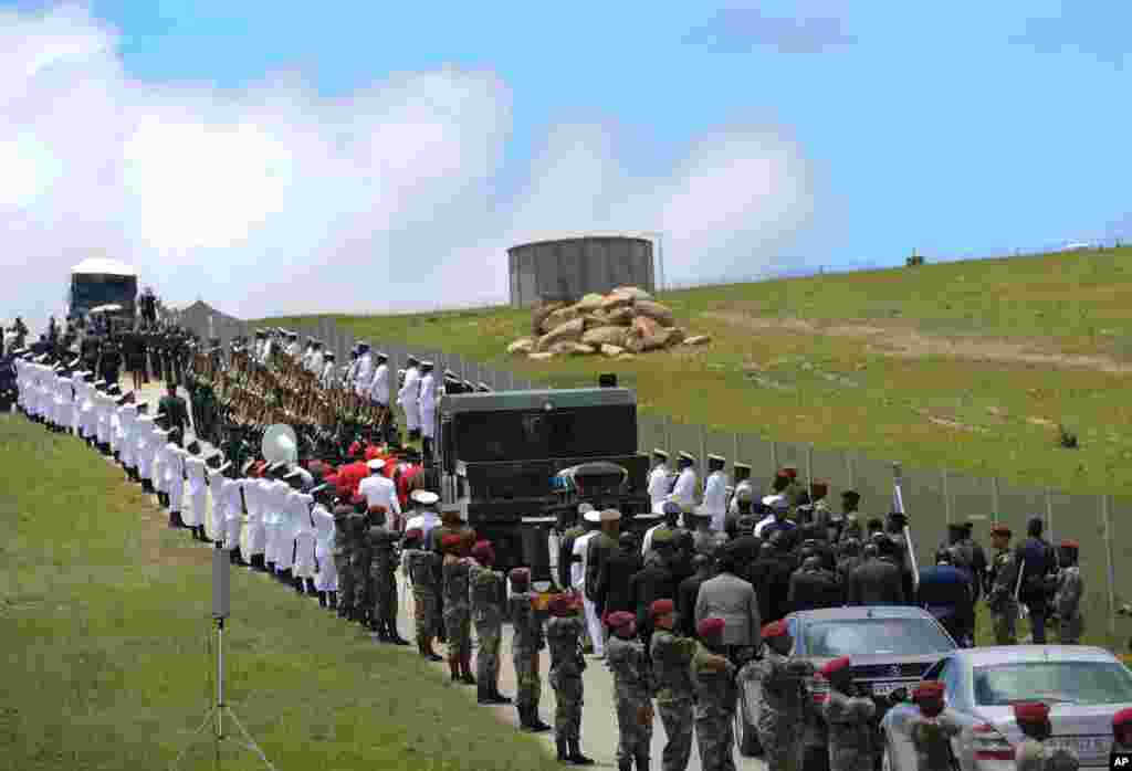 Military personnel line the route as former South African President Nelson Mandela&#39;s casket is taken to its burial place in Qunu. 