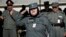 An Afghan policewoman salutes after receiving certification during a graduation ceremony, Herat, Jan. 10, 2013.