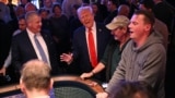 U.S. President Donald Trump visits with patrons at a craps table at Circa Resort & Casino following his remarks on his policy to end tax on tips in Las Vegas, Nevada, Jan. 25, 2025.