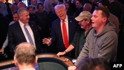 U.S. President Donald Trump visits with patrons at a craps table at Circa Resort & Casino following his remarks on his policy to end tax on tips in Las Vegas, Nevada, Jan. 25, 2025.