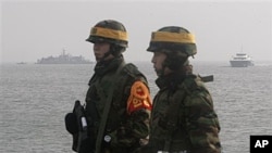 South Korean marines stand guard on Yeonpyeong Island, South Korea, 17 Dec 2010