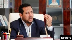 FILE - Abdul Hakeem Belhadj, leader of the Al-Watan party, speaks during an interview with Reuters in Tripoli, March 4, 2015. 