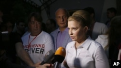 FILE - Then-presidential candidate Yulia Tymoshenko speaks to press in Kyiv, May 25, 2014.