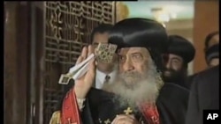  ສັນຕະປາປາ Shenouda III ຂອງສາສະໜາຄຣິສ ນິກາຍຄອບຕິກ ຂອງອີຈິບ.
ວັນທີ 19 ມີນາ 2012.