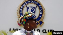 Lawyer Mudrakat Alabi Macfoy arrives at Lagos Polo Club during the 2019 Lagos International Polo Tournament, Nigeria, March 16, 2019. 