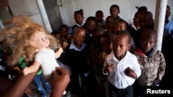 A volunteer from Simelela teaches children how to protect themselves at a school in South Africa.