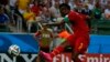 Asamoah Gyan frappe au but lors d'un match contre l'Allemagne lors du mondial 2014, Brésil, le 21 juin 2014