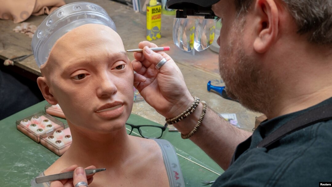 The rubberised head of Ai-Da, a humanoid robot capable of drawing people from life using her bionic eyes and hand, is given lifelike features by Mike Humphrey, a specialist at robotics company Engineered Arts, in Falmouth, Cornwall, Britain February 7, 20