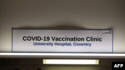A sign in the Covid-19 Vaccination Clinic at the University Hospital in Coventry, central England is pictured on Dec. 4, 2020, prior to the NHS administering jabs to the most vulnerable early next week.