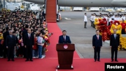 China's President Xi Jinping speaks upon his arrival at Macau's international airport in Macau on Dec. 18, 2024, ahead of celebrations for the 25th anniversary of Macau's handover from Portugal to China.