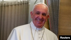 Pope Francis is pictured aboard his aircraft while en route to the United States, Sept. 22, 2015.