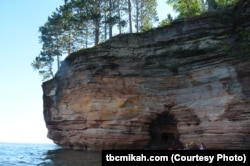 Kayakers get a unique perspective of the sea caves at Apostle Islands National Lakeshore in Wisconsin