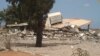 A collapsed criminal evidence building after an attack by Islamic hard-line militias in Benghazi, Libya, Aug. 1, 2014.