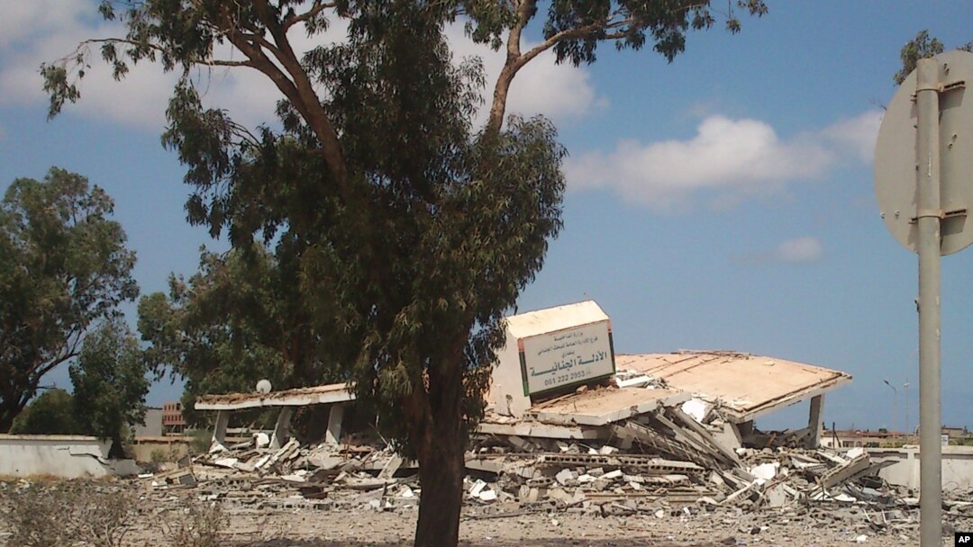 A collapsed criminal evidence building after an attack by Islamic hard-line militias in Benghazi, Libya, Aug. 1, 2014.