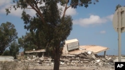 A collapsed criminal evidence building after an attack by Islamic hard-line militias in Benghazi, Libya, Aug. 1, 2014.