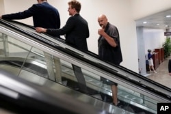 FILE - Sen. John Fetterman, D-Pa., gestures as he rides an elevator near the Senate Subway on Capitol Hill on September 6, 2023, in Washington. (AP Photo/Mariam Zuhaib, File)