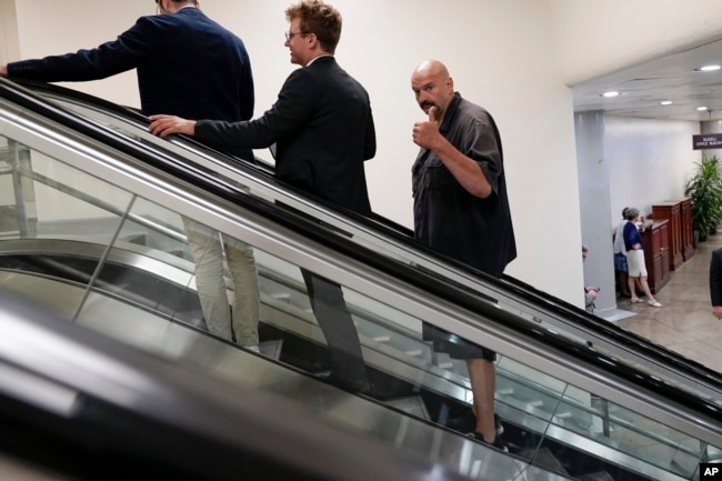 FILE - Sen. John Fetterman, D-Pa., gestures as he rides an elevator near the Senate Subway on Capitol Hill on September 6, 2023, in Washington. (AP Photo/Mariam Zuhaib, File)