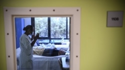 TOPSHOT - A nurse speaks with a patient with mental disorders in her room at The Ville-Evrard Psychiatric Hospital in Saint-Denis, north of Paris on November 3, 2020. - After the consequences of the first confinement linked to Covid-19 are just…