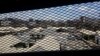 FILE - A view through a mesh window looks out over part of Aden Central Prison, known as Mansoura, in Aden, Yemen, May 9, 2017. 