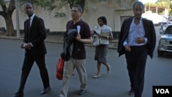 Mozambique - Convicted murderer Vicente Ramaya on his release. On his left without a tie is his lawyer Abdul Gani